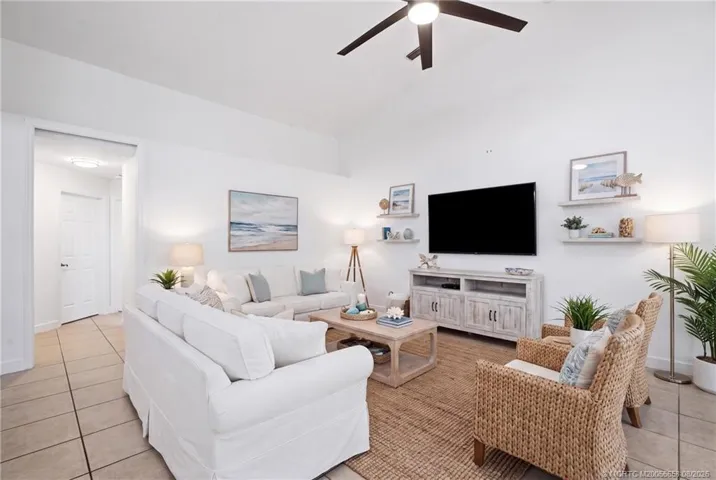 Virtually staged living space. Open floor plan, large living area with high ceilings.