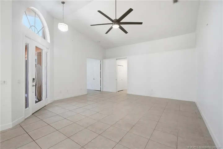 Open floor plan, large living area with high ceilings.