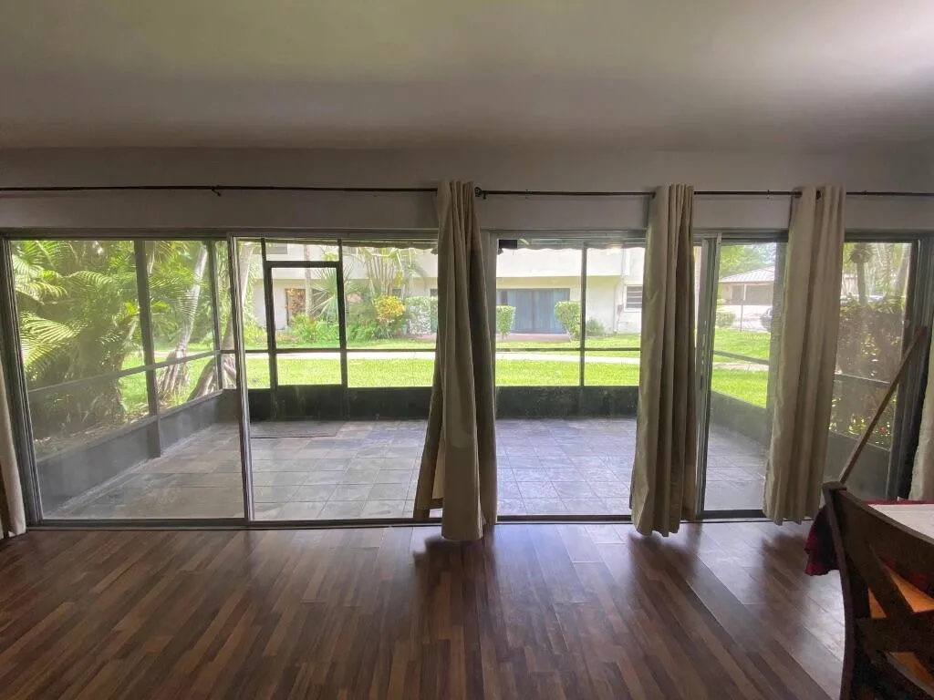 The wall to wall sliding doors makes a perfect visual to the outdoor screen patio.