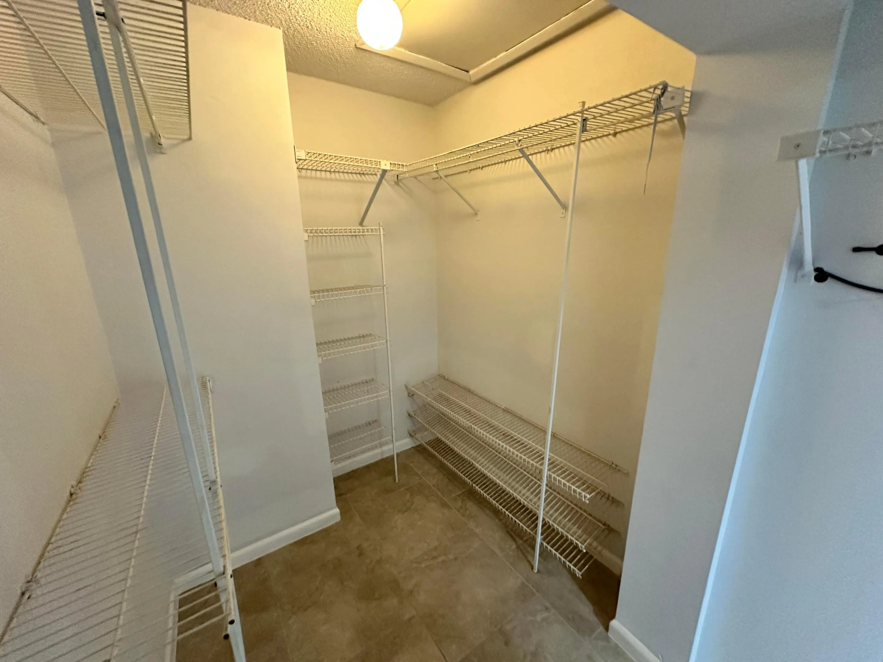 Generous Walk-In Closet with Built-In Shelving