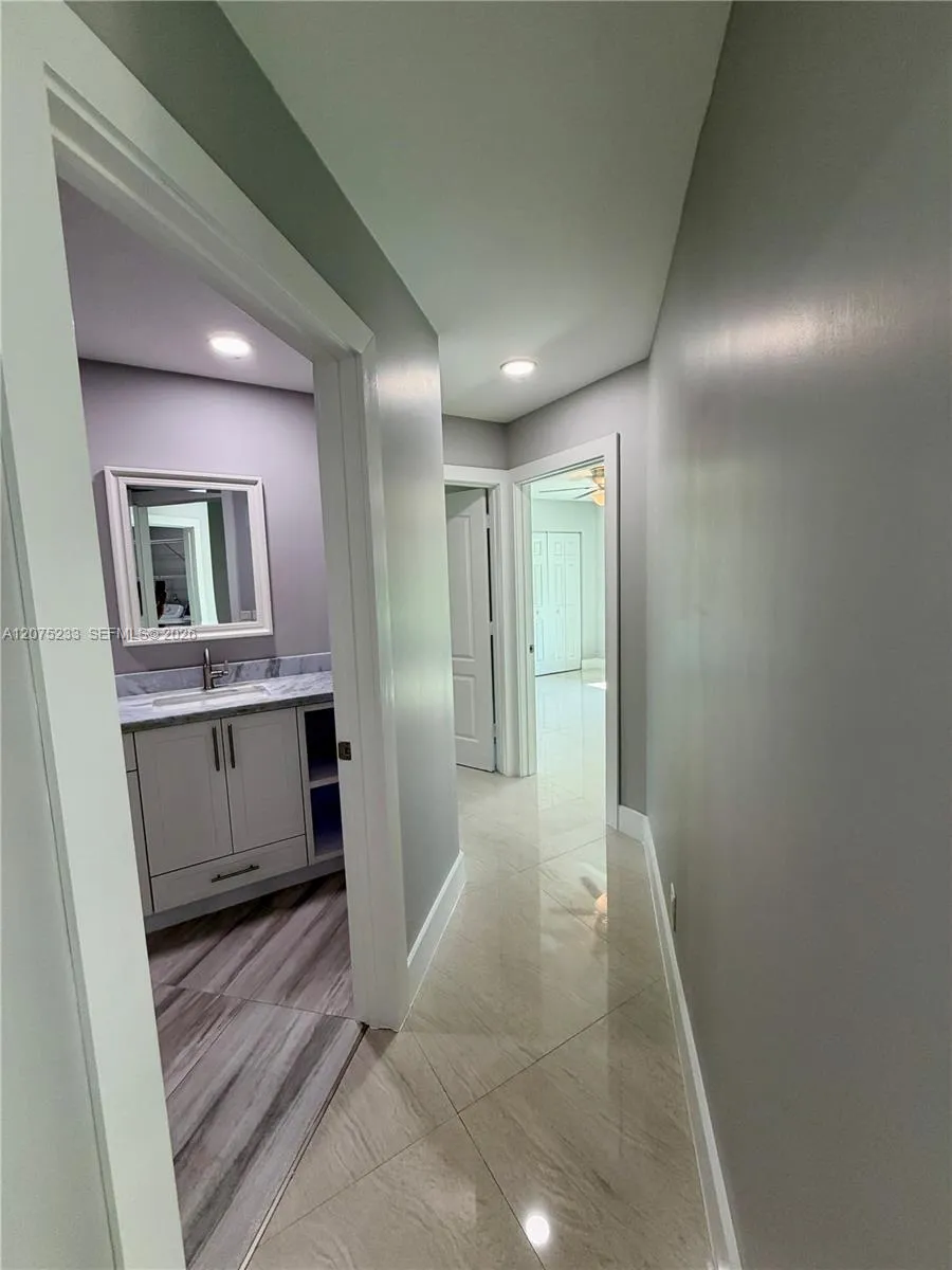 Hallway to 2nd bathroom ,and two bedrooms.