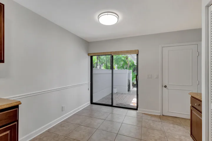 Inviting breakfast area with sliding glass doors leading to the outdoor space, bringing in plenty of natural light.