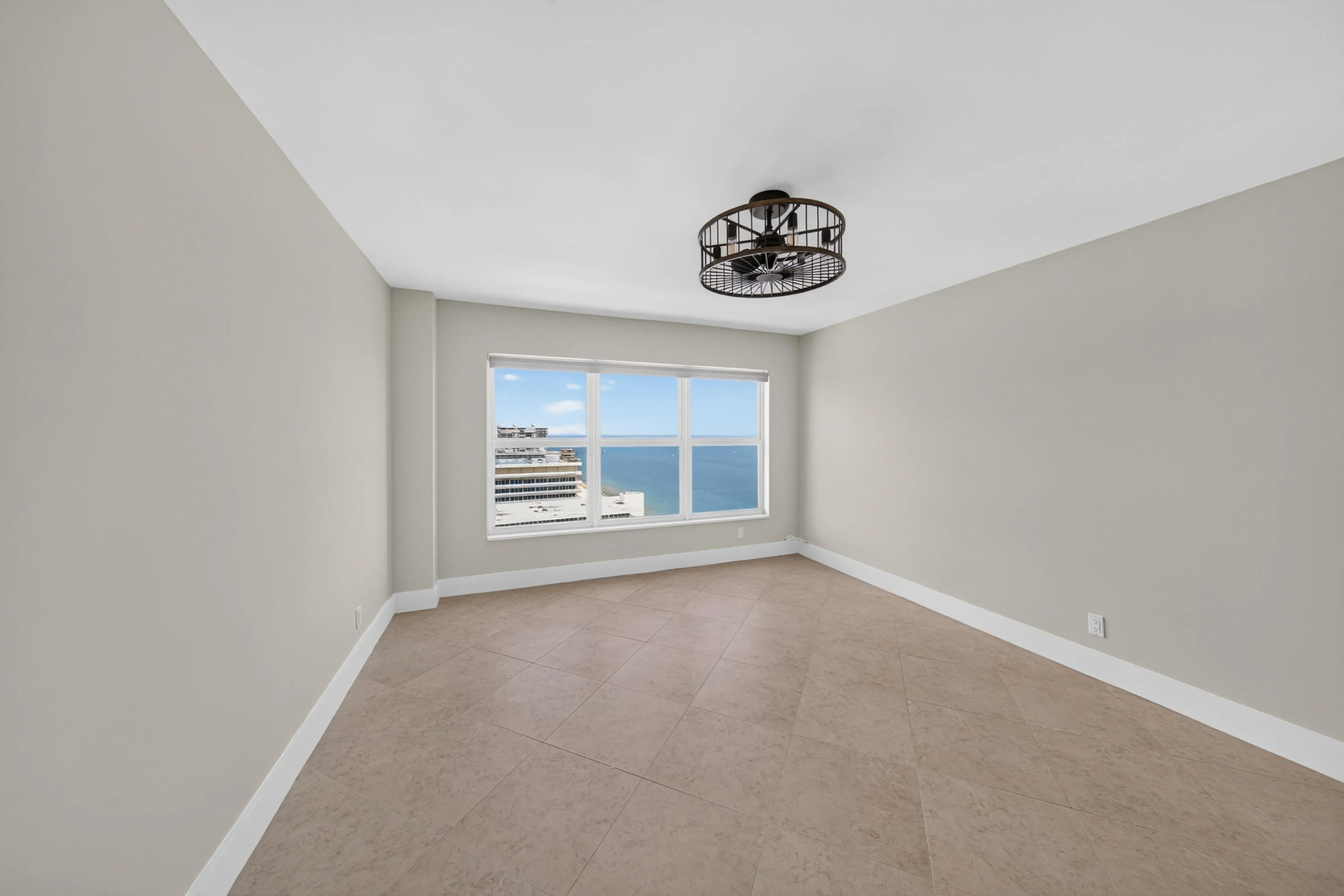 Generously proportioned third bedroom offering tile flooring, abundant natural light and Atlantic Ocean views.