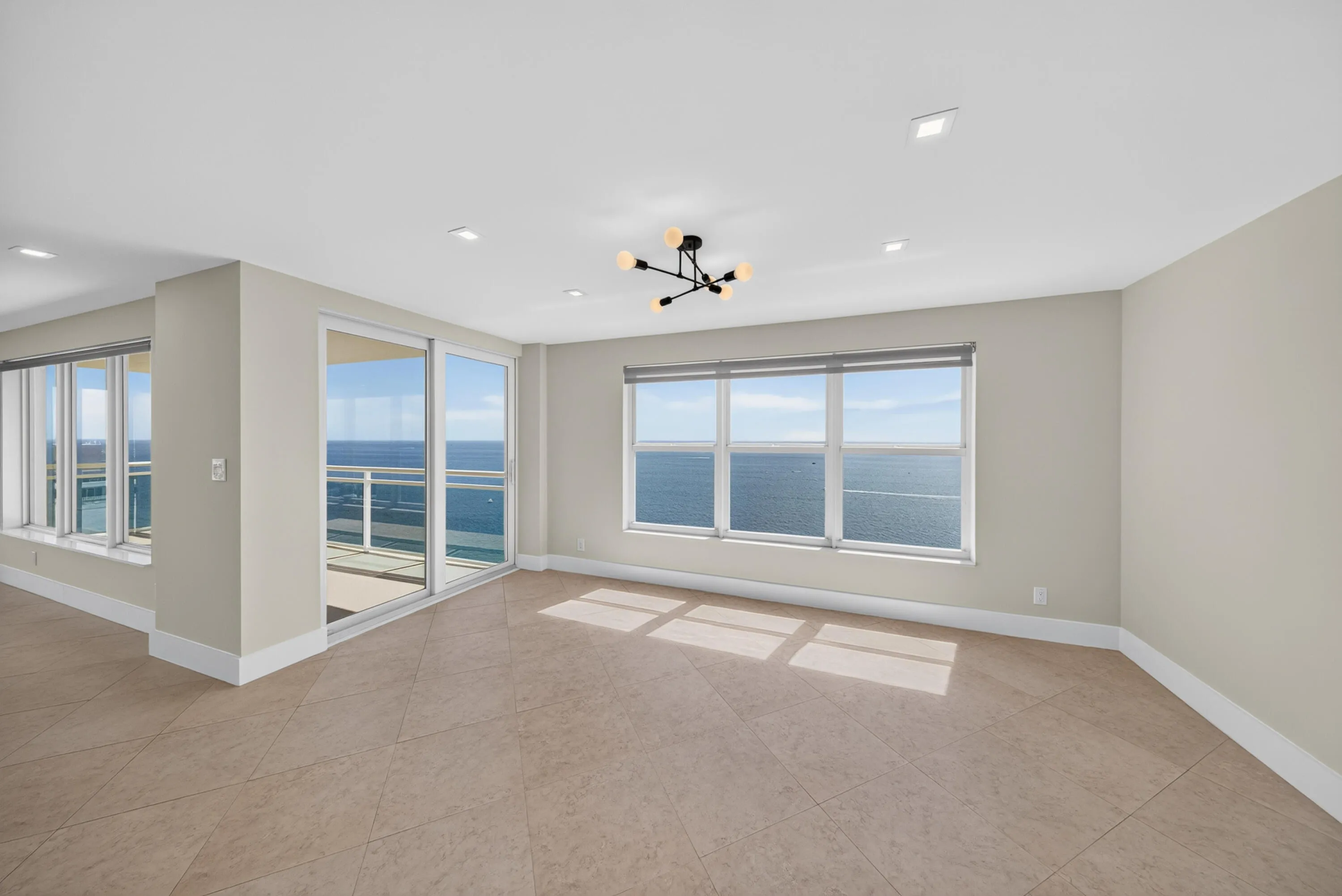 A light-filled dining area opens directly to the wraparound balcony and sweeping Atlantic
