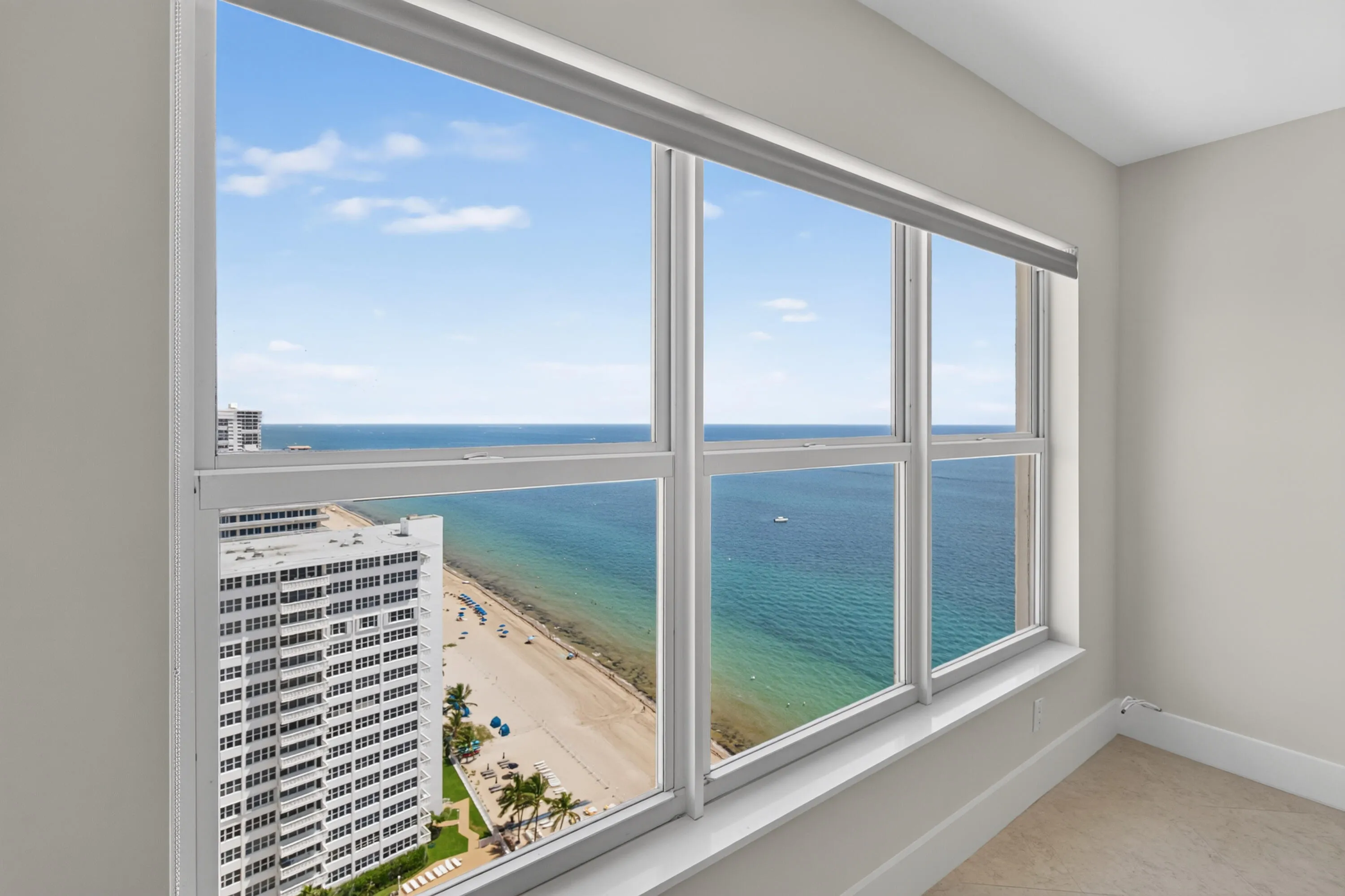 Wake to sweeping views of the Atlantic and coastline through upgraded high-impact windows.