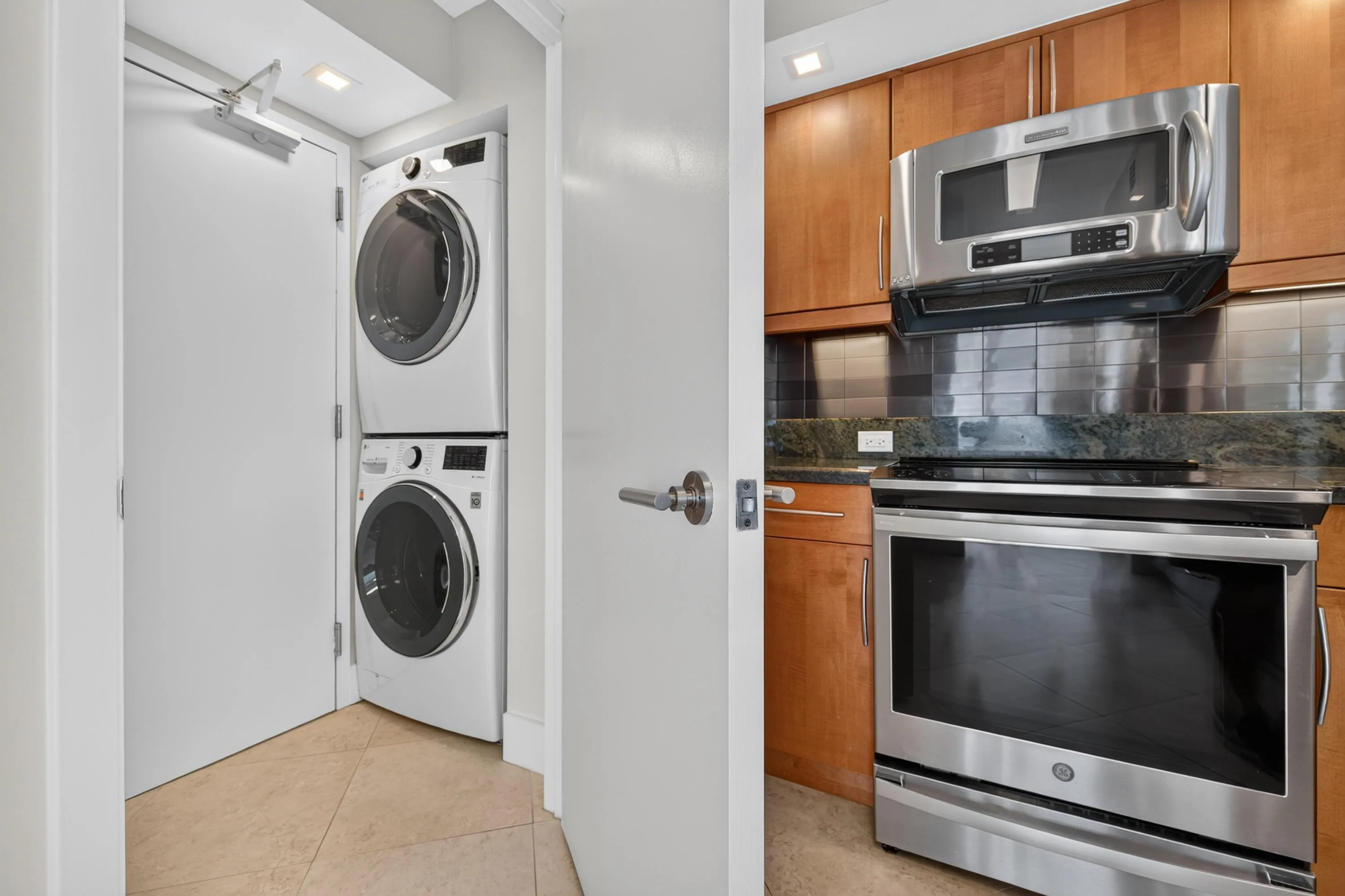 Convenient full-size washer and dryer are thoughtfully located adjacent to the kitchen.