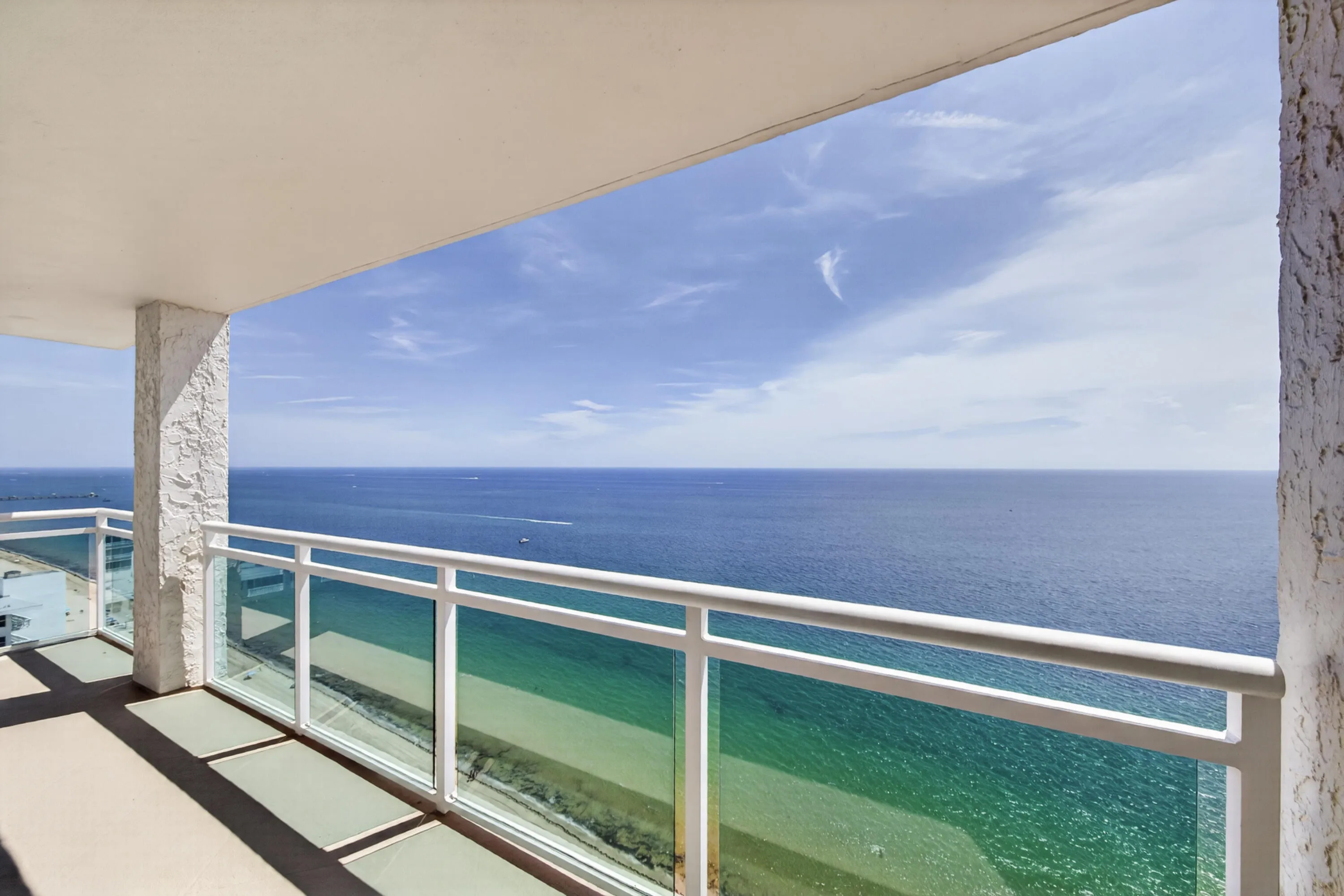 Breathtaking panoramic views extend across the Atlantic from the residence’s elevated oceanfront setting.