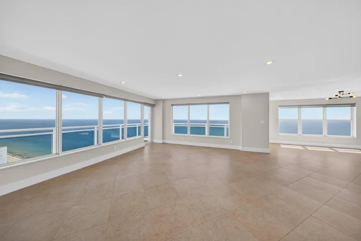Sweeping ocean views from nearly every vantage point define this expansive northeast corner residence.