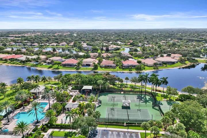 Expansive community featuring multiple tennis courts, a large swimming pool, and a recreational building with extensive gym and a bonus entertainment room