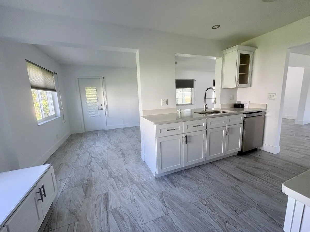 Kitchen and dining area view from garage entrance