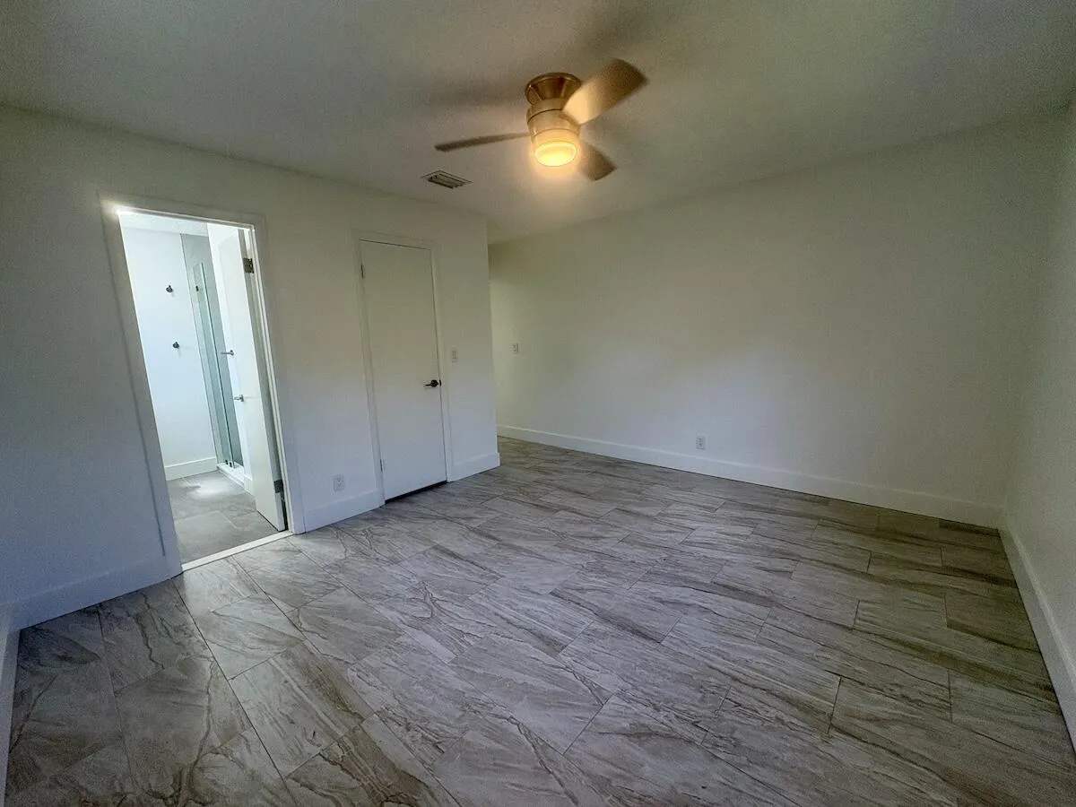 master bedroom with walk in closet