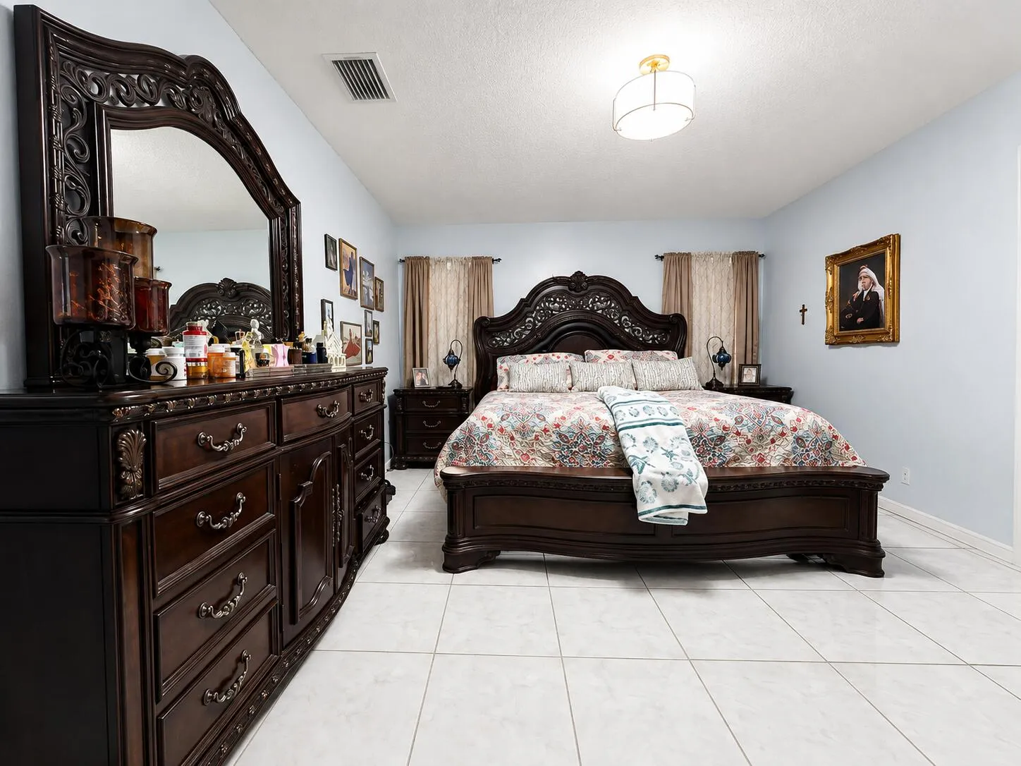 Recessed ceiling fixture, light blue wall paint, and tiled flooring