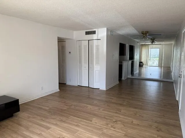 Dining area with decorative wall mirror