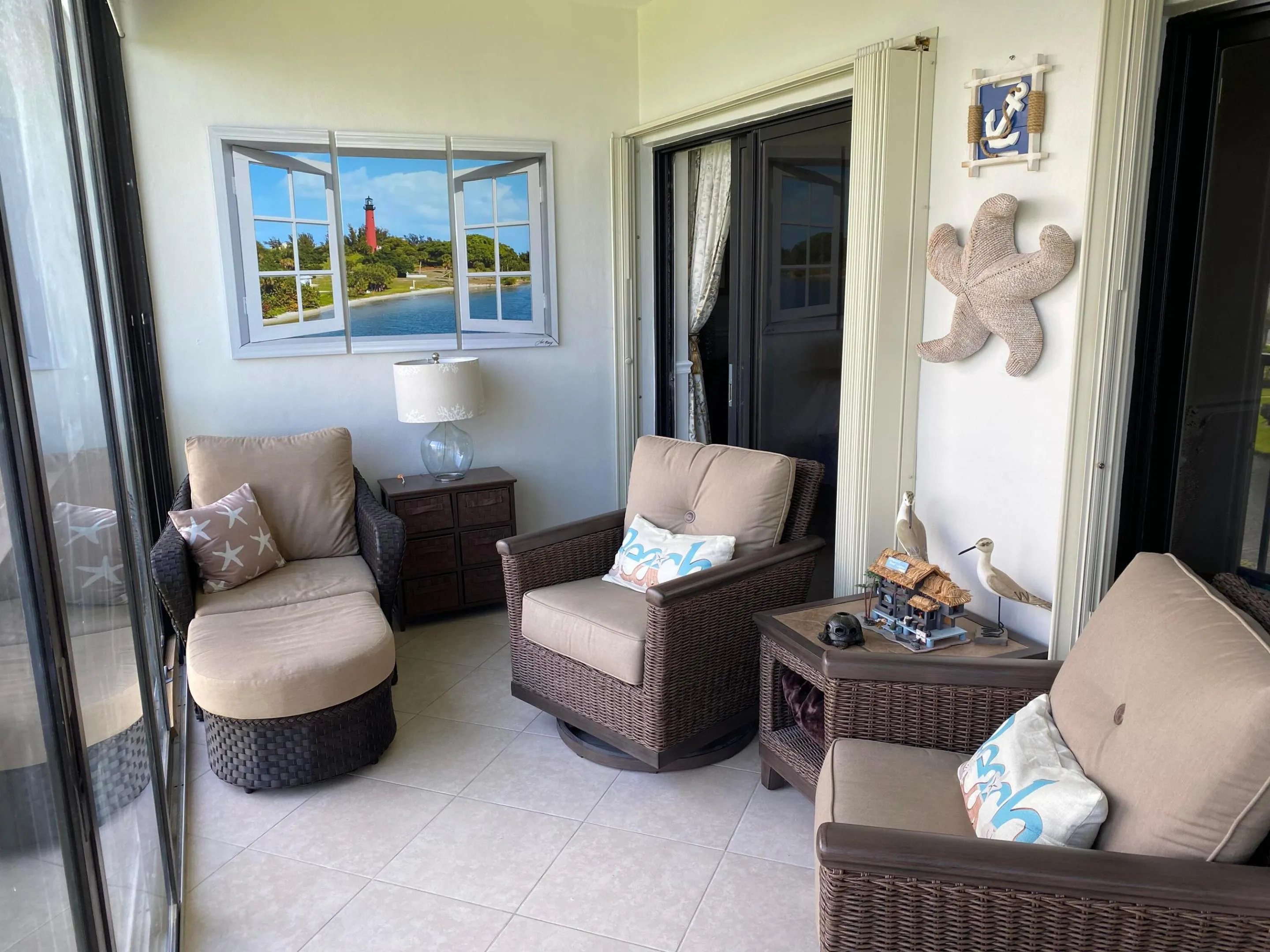 Tiled flooring, wall-mounted decorative art, and glass sliding doors