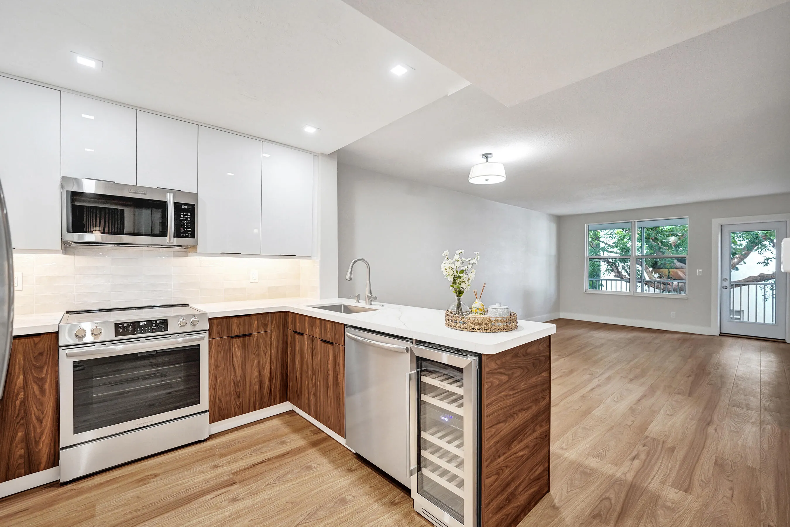 Kitchen - SS appliances, wine fridge and quartz counters