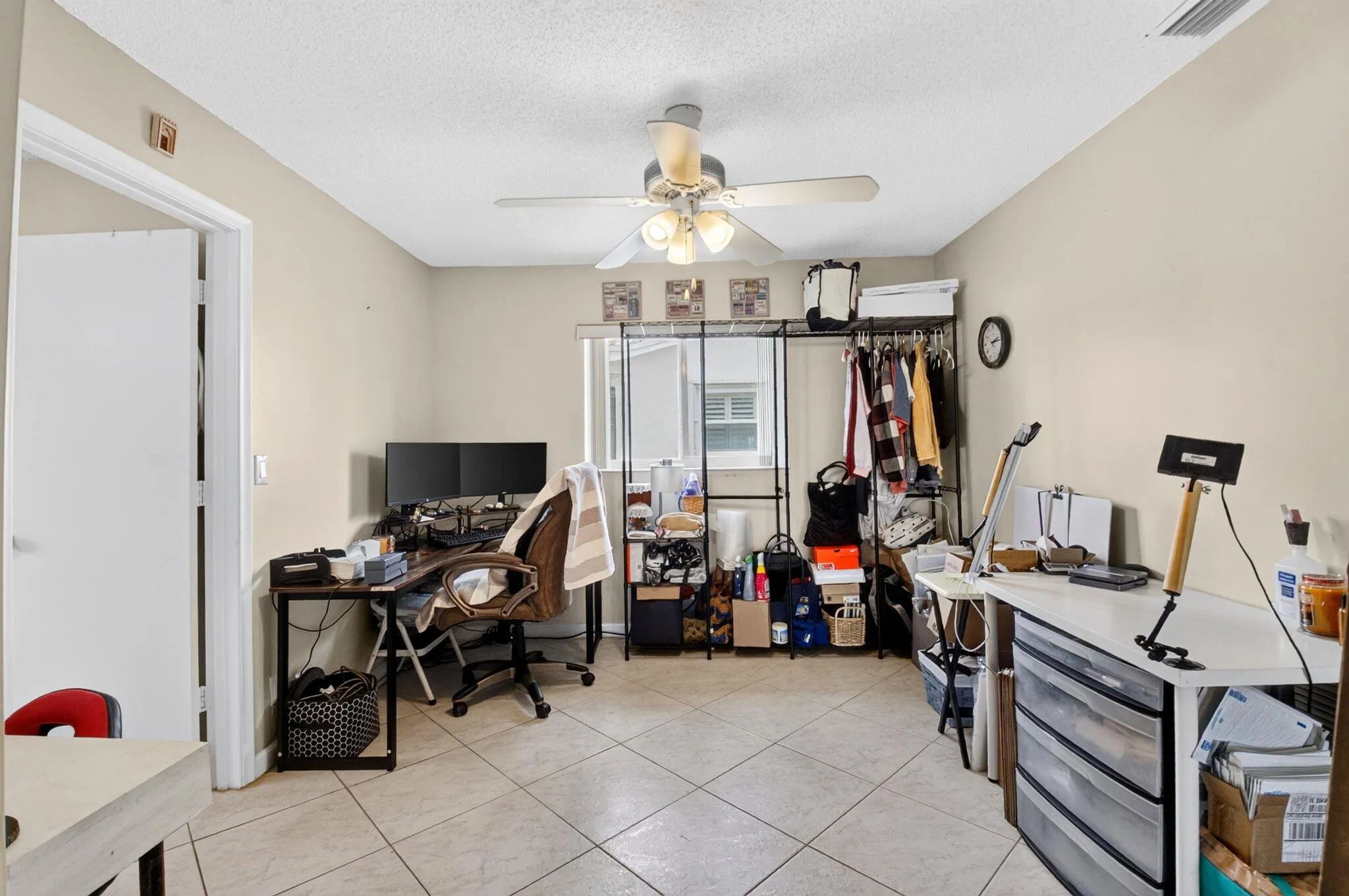 Neutral-toned walls complement the tile flooring