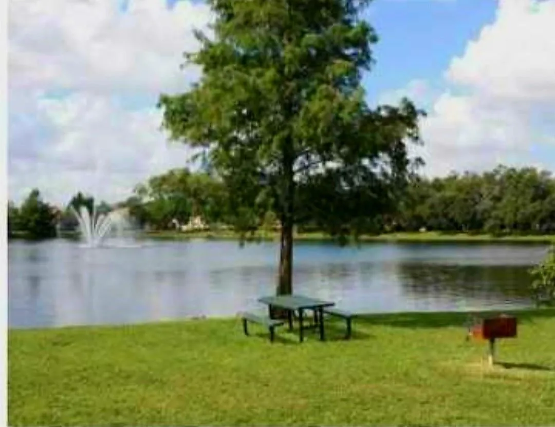 Expansive waterfront setting with a central fountain