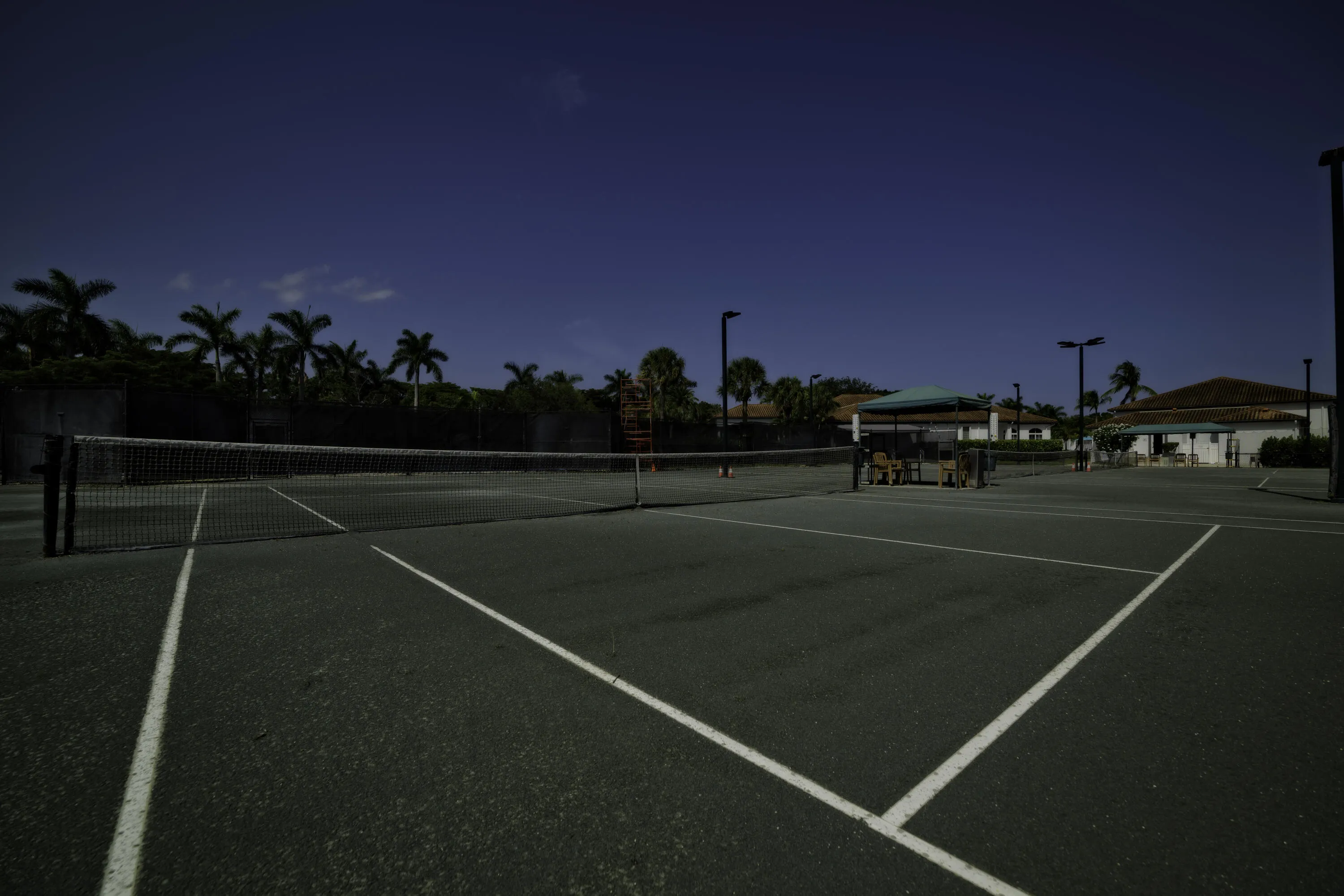 A tennis program with a pro on grounds. Lights for night time play