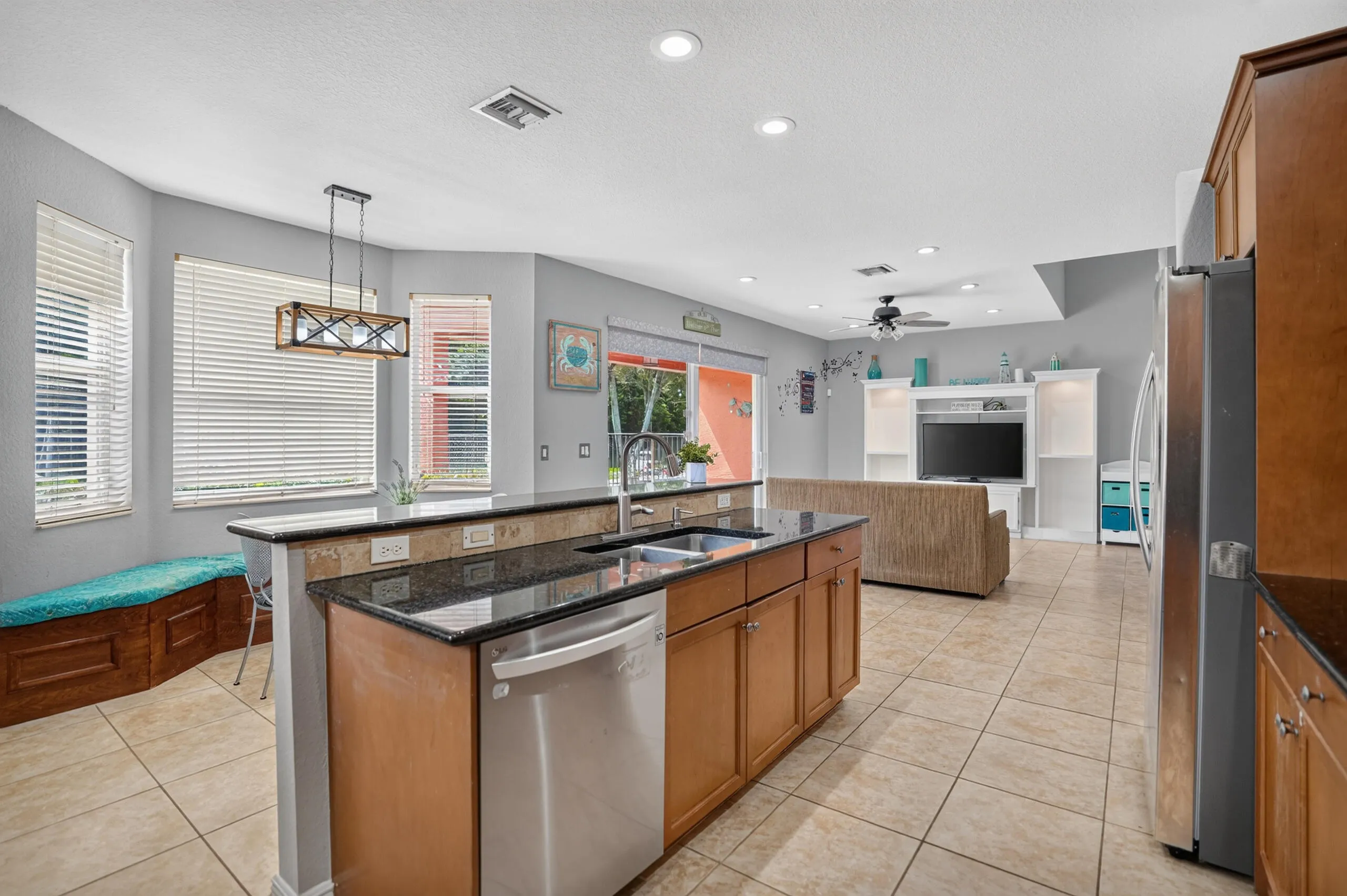 Spacious kitchen with granite countertops, newer stainless steel appliances, and