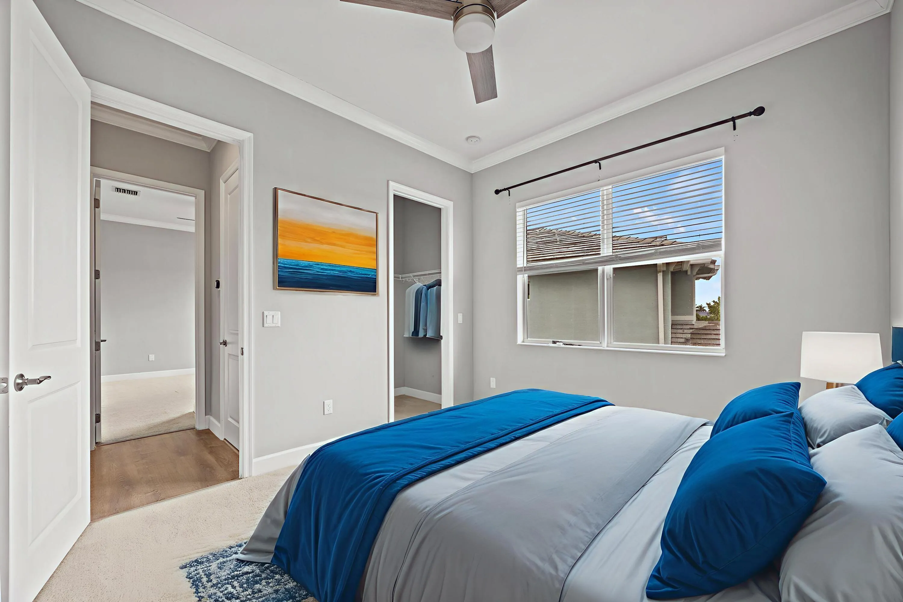 Recessed lighting, crown molding, ceiling fan, window with blinds, and built-in closet with shelving