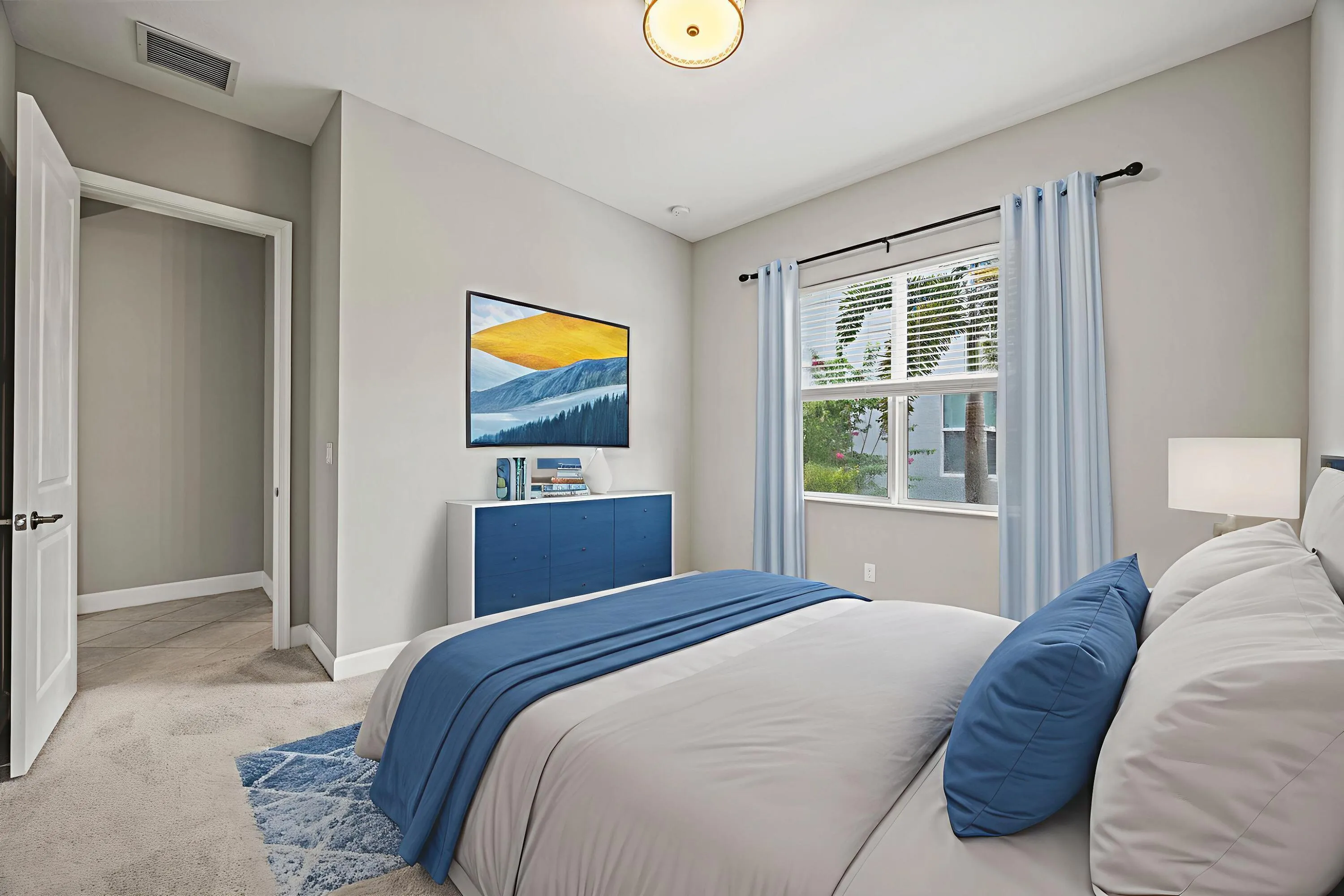 Recessed lighting, light gray wall tones, window with vertical blinds, ceiling-mounted light fixture, and carpeted flooring