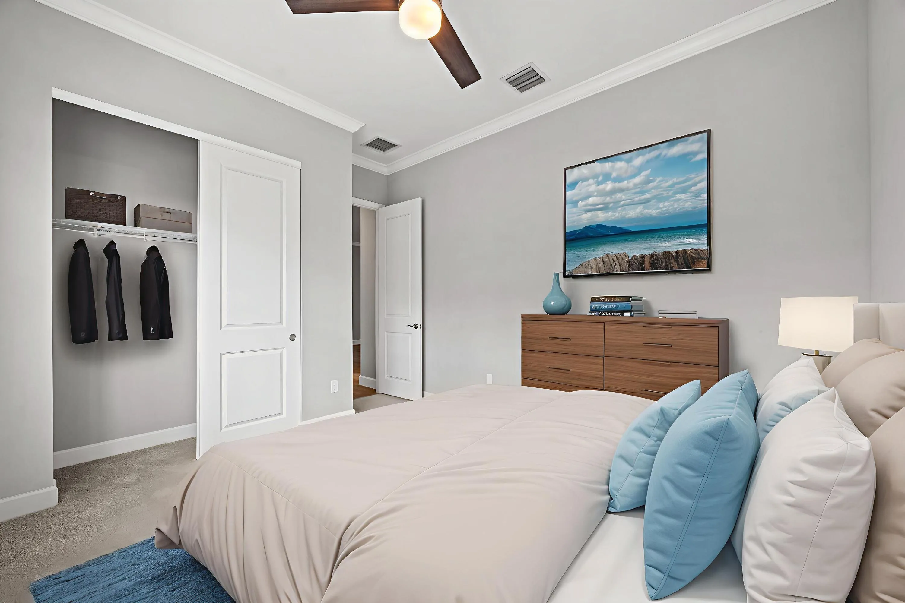 Recessed lighting, crown molding, and a ceiling fan enhance the room