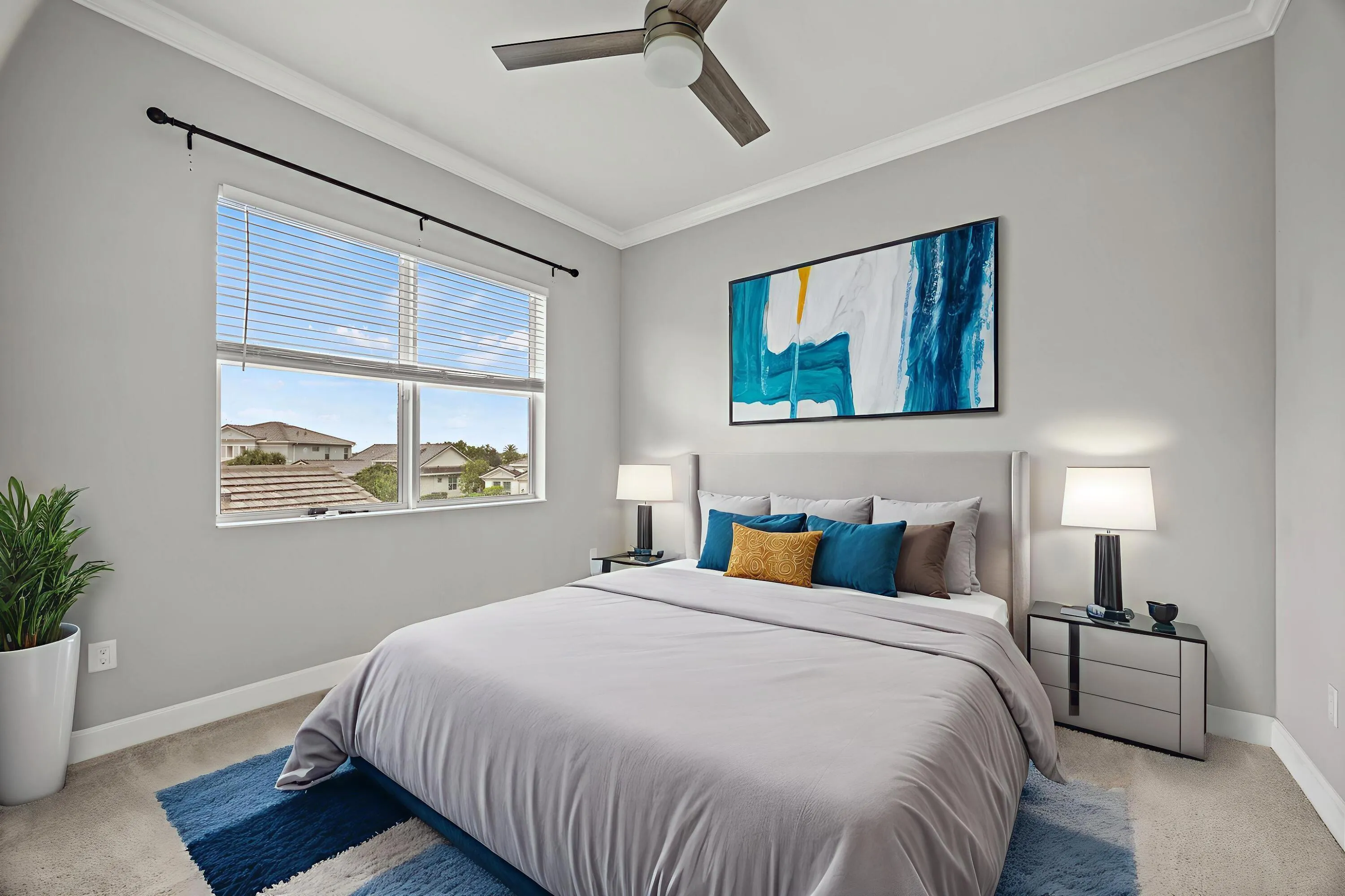 Ceiling fan with wooden-finish blades, crown molding, double window with blinds, and light gray wall paint