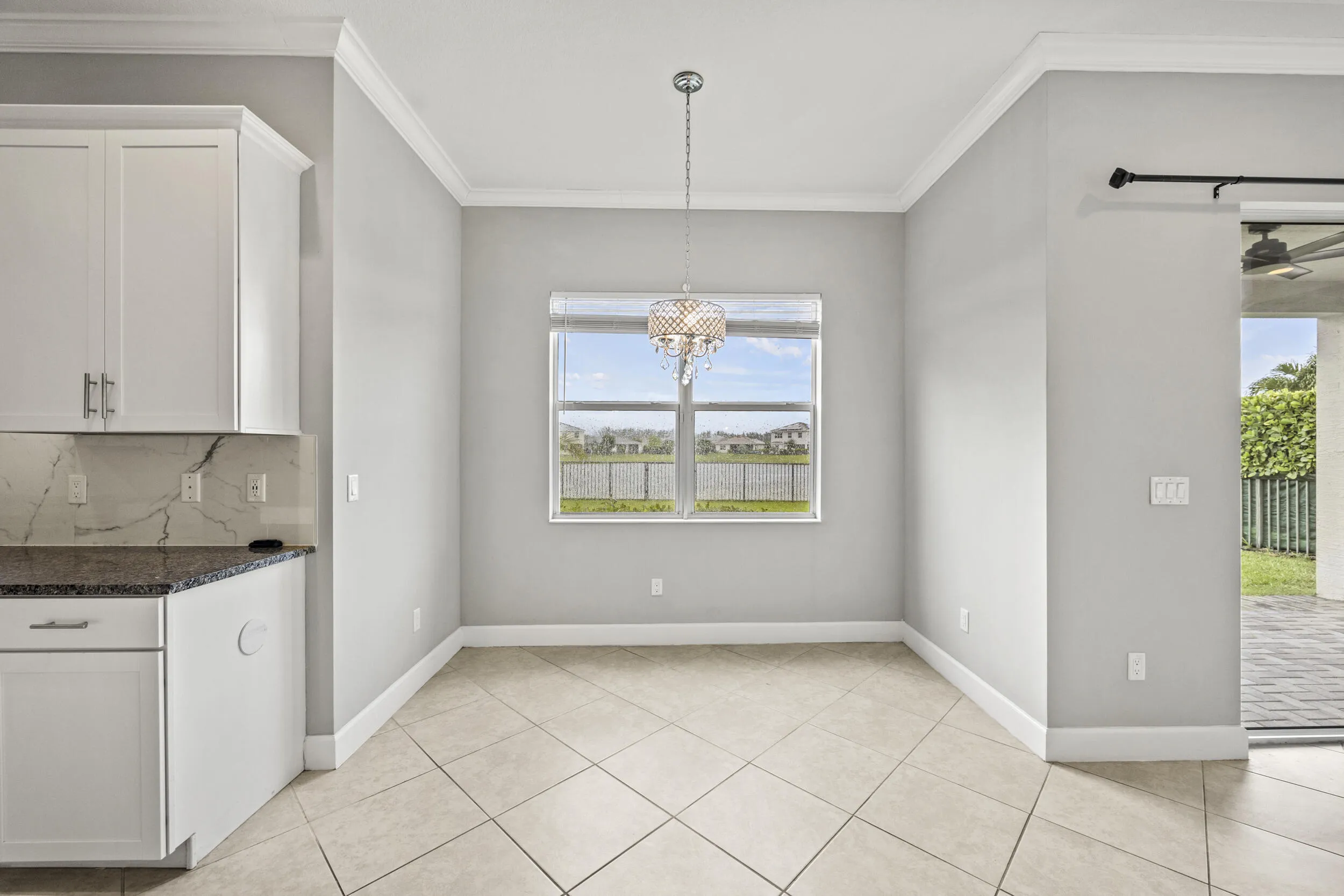 Recessed lighting and crown molding accentuate the high ceilings