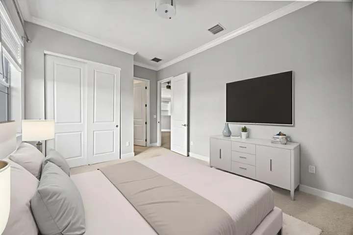 Recessed lighting, crown molding, double-panel closet doors, and light gray wall paint