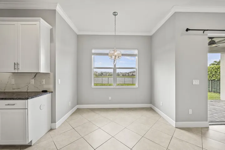 Recessed lighting and crown molding accentuate the high ceilings