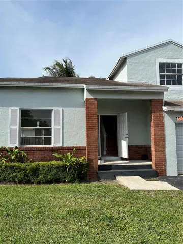 Front of home with one car garage.