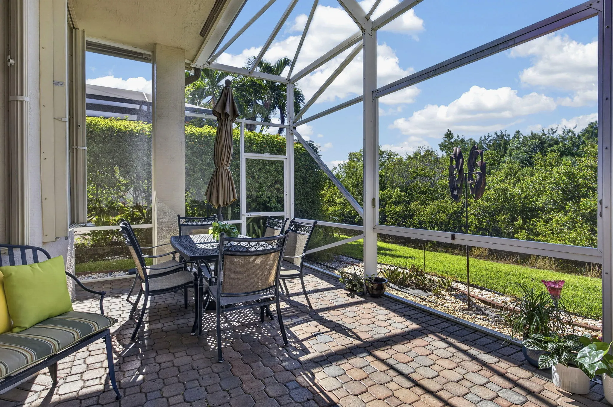 Expanded Screened in Patio with Rock in Plant Bed outside the screening