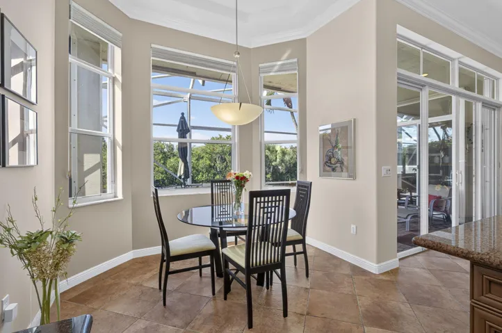 Bay Windows highlight this sunny breakfast area