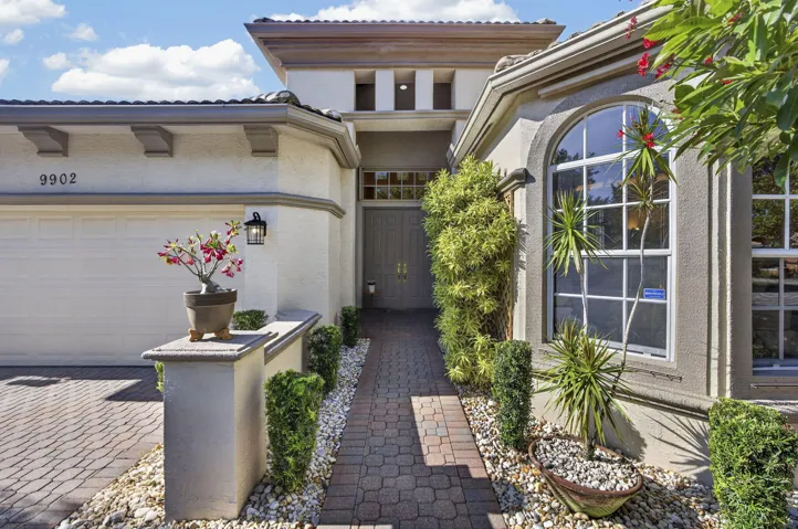 These front bedroom windows have storm protection with Clear Storm Panels stored in garage