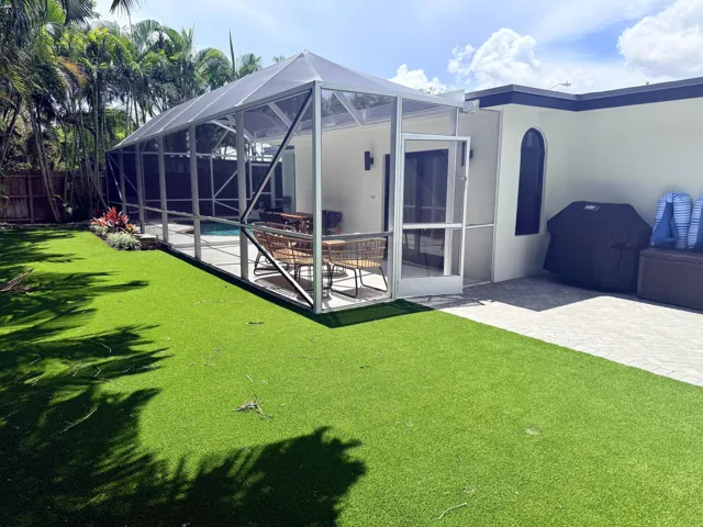 View of back patio with putting green