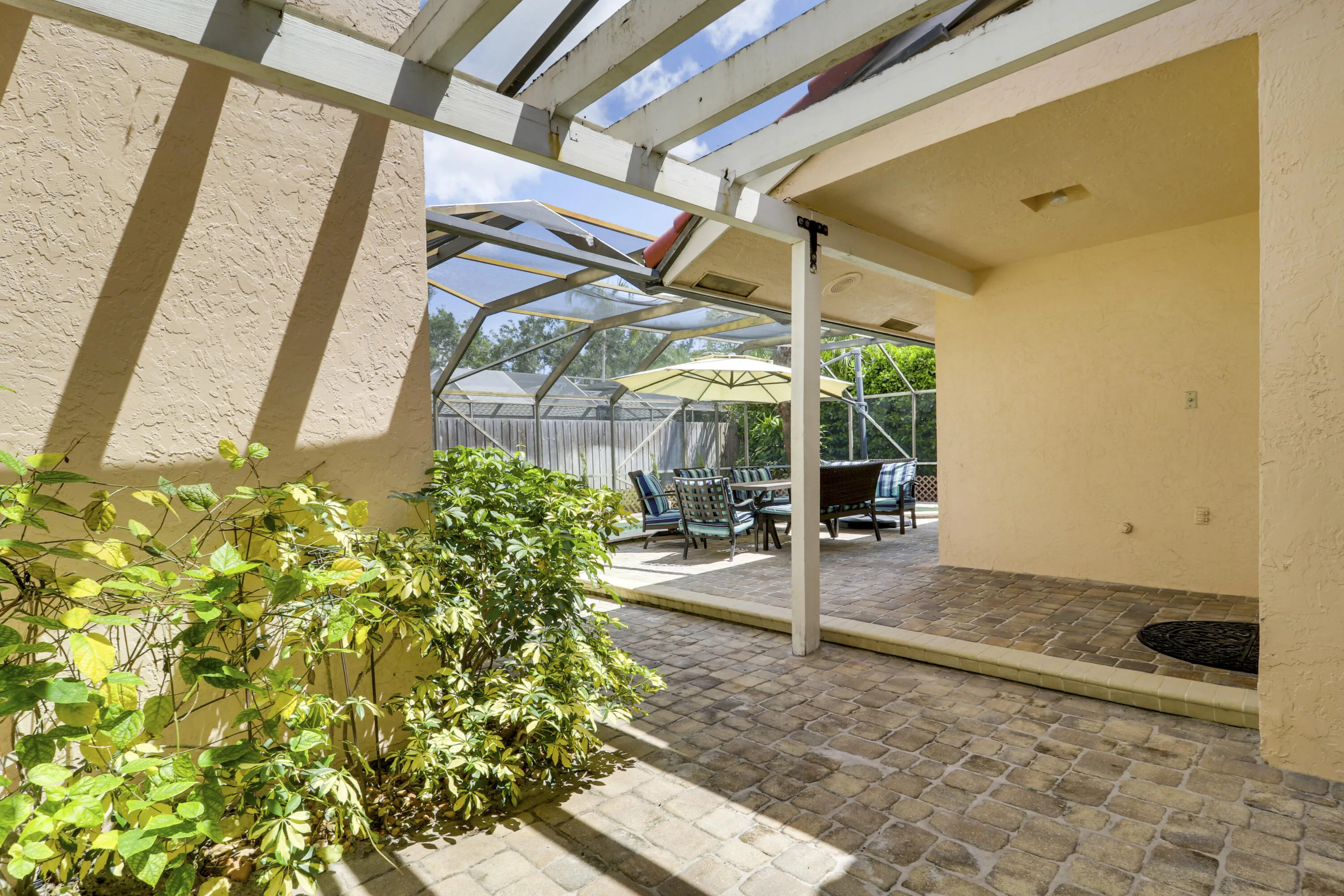 Pergola-covered outdoor retreat with space for lounging, dining or a future hot tub