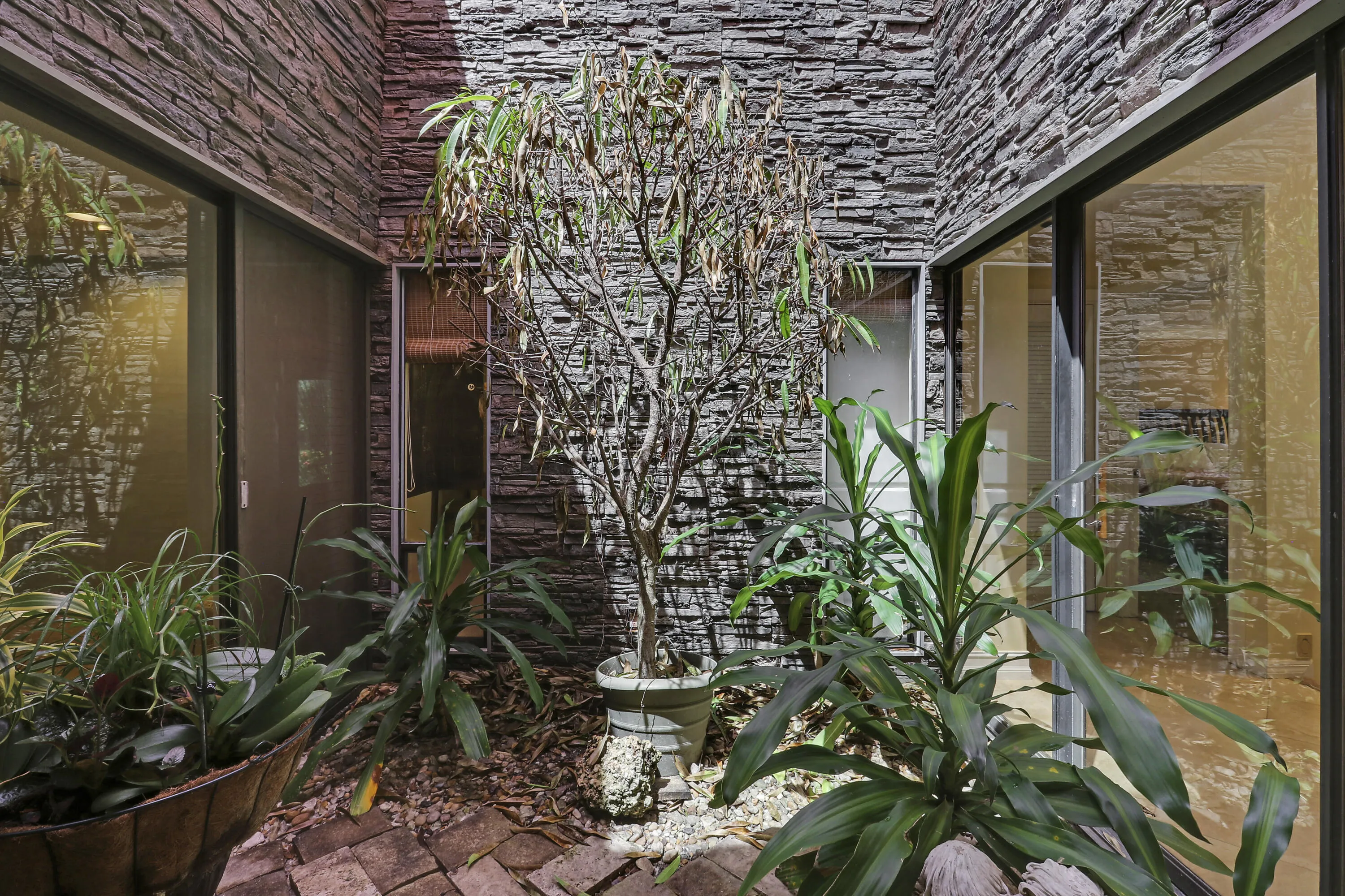 Interior atrium brings natural light into the heart of the home