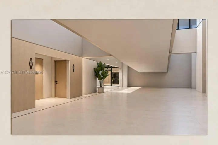 Spacious interior with light-toned tile flooring, light wood-finish wall panels, and high ceilings