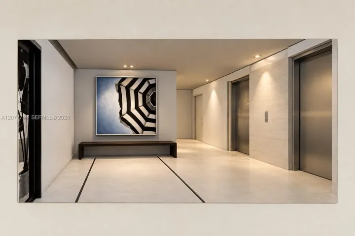 Recessed ceiling lighting, light-toned flooring with dark inlay, and multiple elevator access points