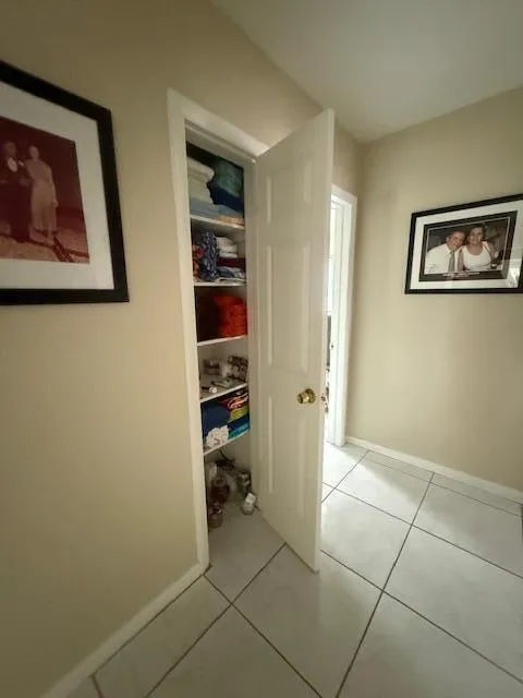 hallway linen closet between bedrooms