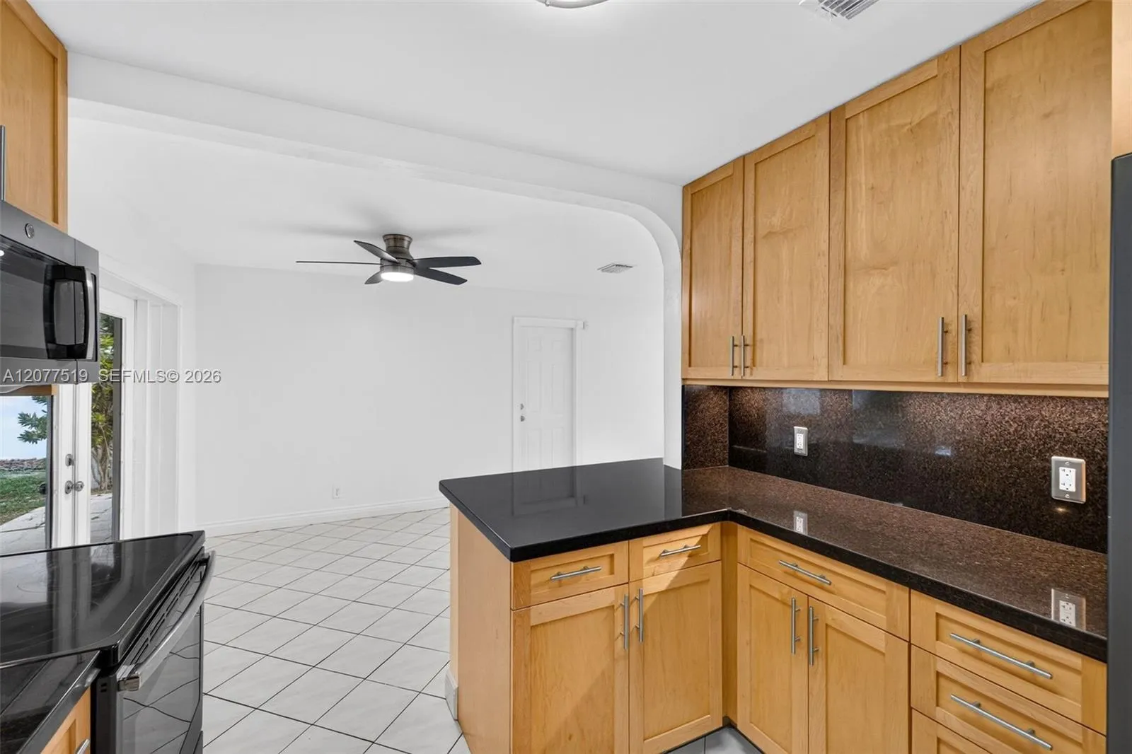 Updated 2017 kitchen featuring birch cabinetry, quartz countertops and GE appliances.