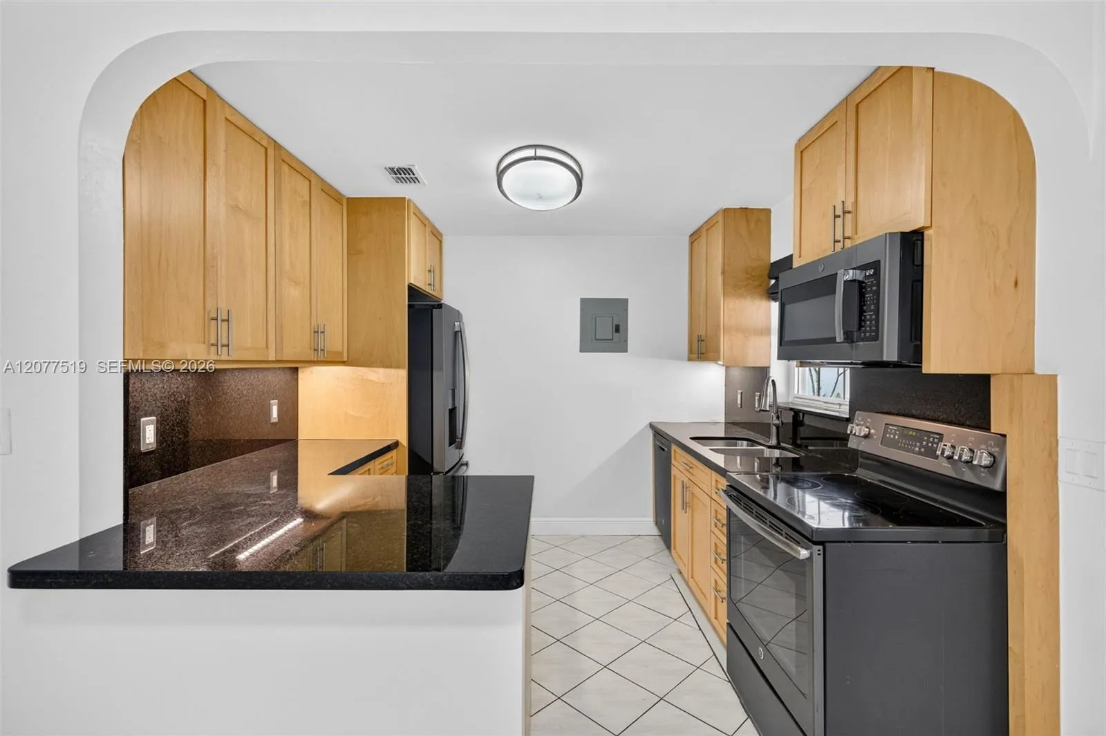 Updated 2017 kitchen featuring birch cabinetry, quartz countertops and GE appliances.​​‌​​​​‌​​‌‌​‌‌​​​‌‌​‌​‌​‌​​​‌​​ Virtually-Staged.