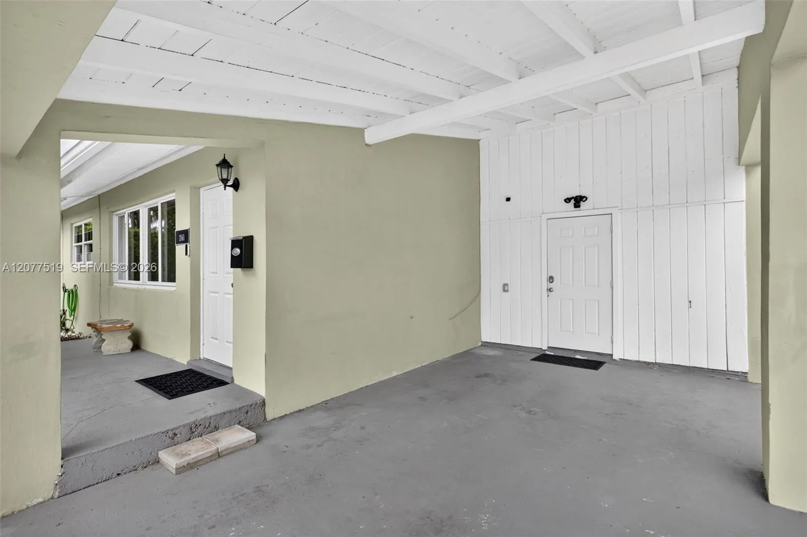 Covered one-car carport provides convenient sheltered parking.