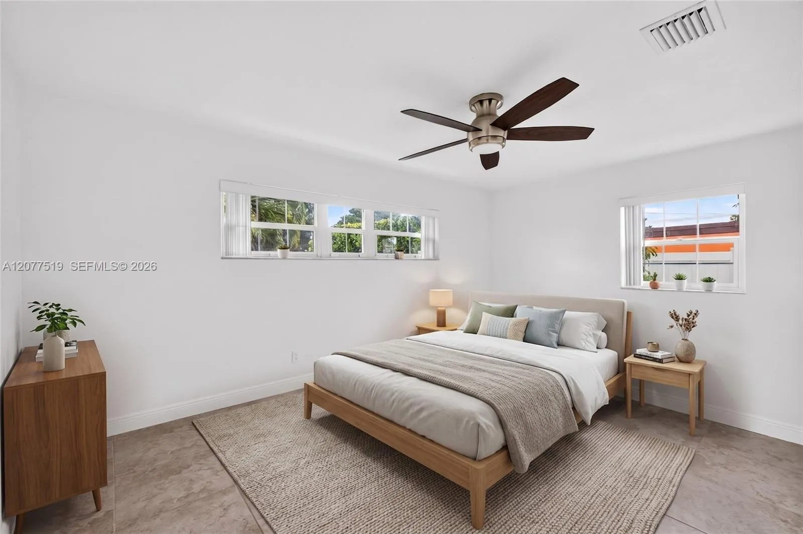 Light-filled bedroom with updated flooring, blinds and generous closet storage. Virtually-Staged.