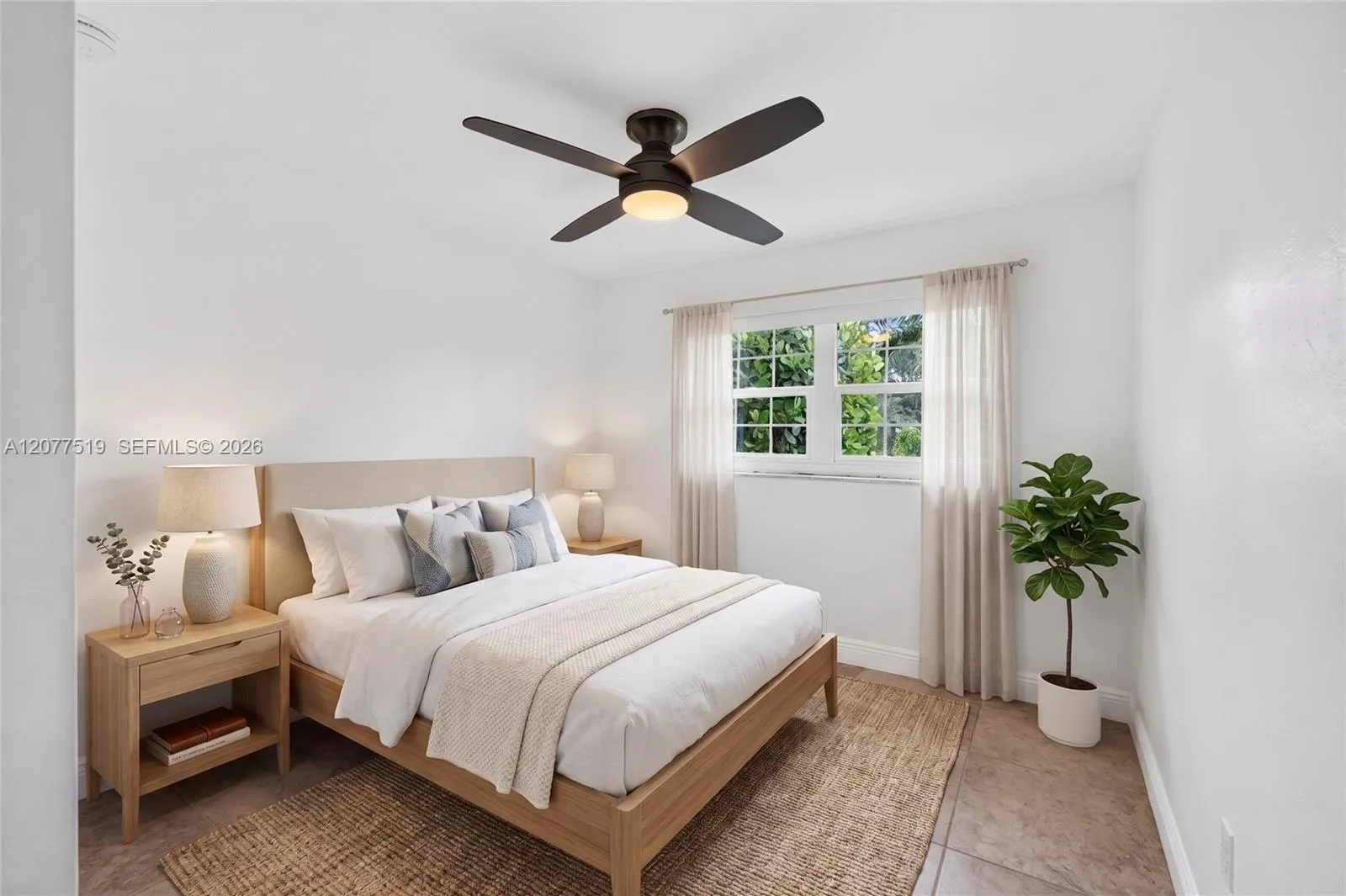 Versatile third bedroom with natural light, updated flooring and closet space. Virtually-Staged