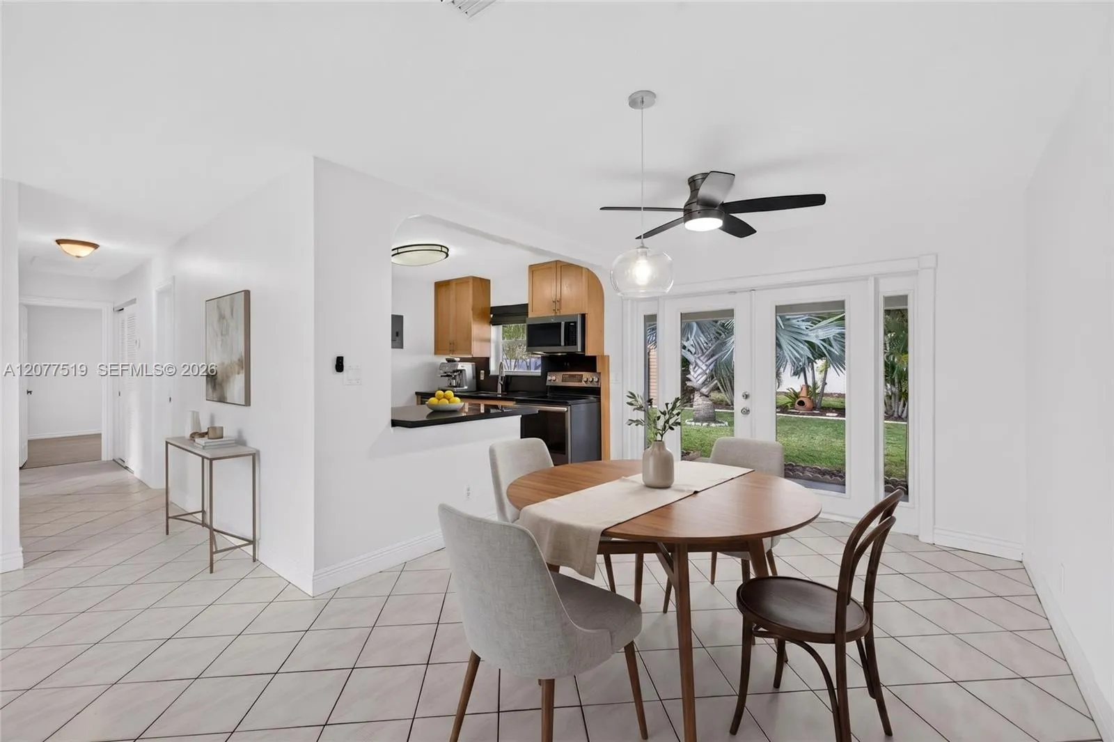 Dining area conveniently positioned within the main living space for easy entertaining. Virtually-staged.
