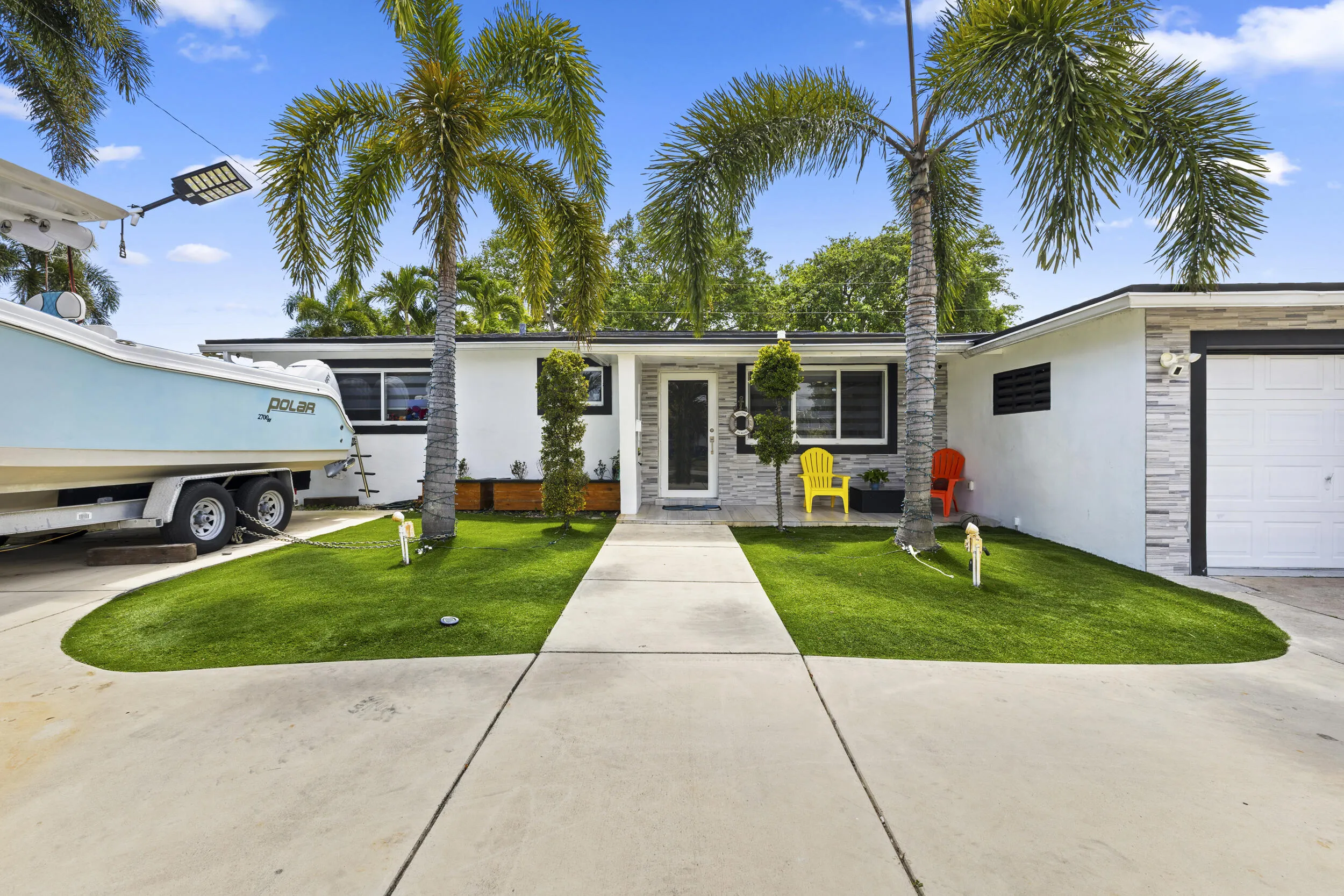 Beautiful palm trees with artificial grass