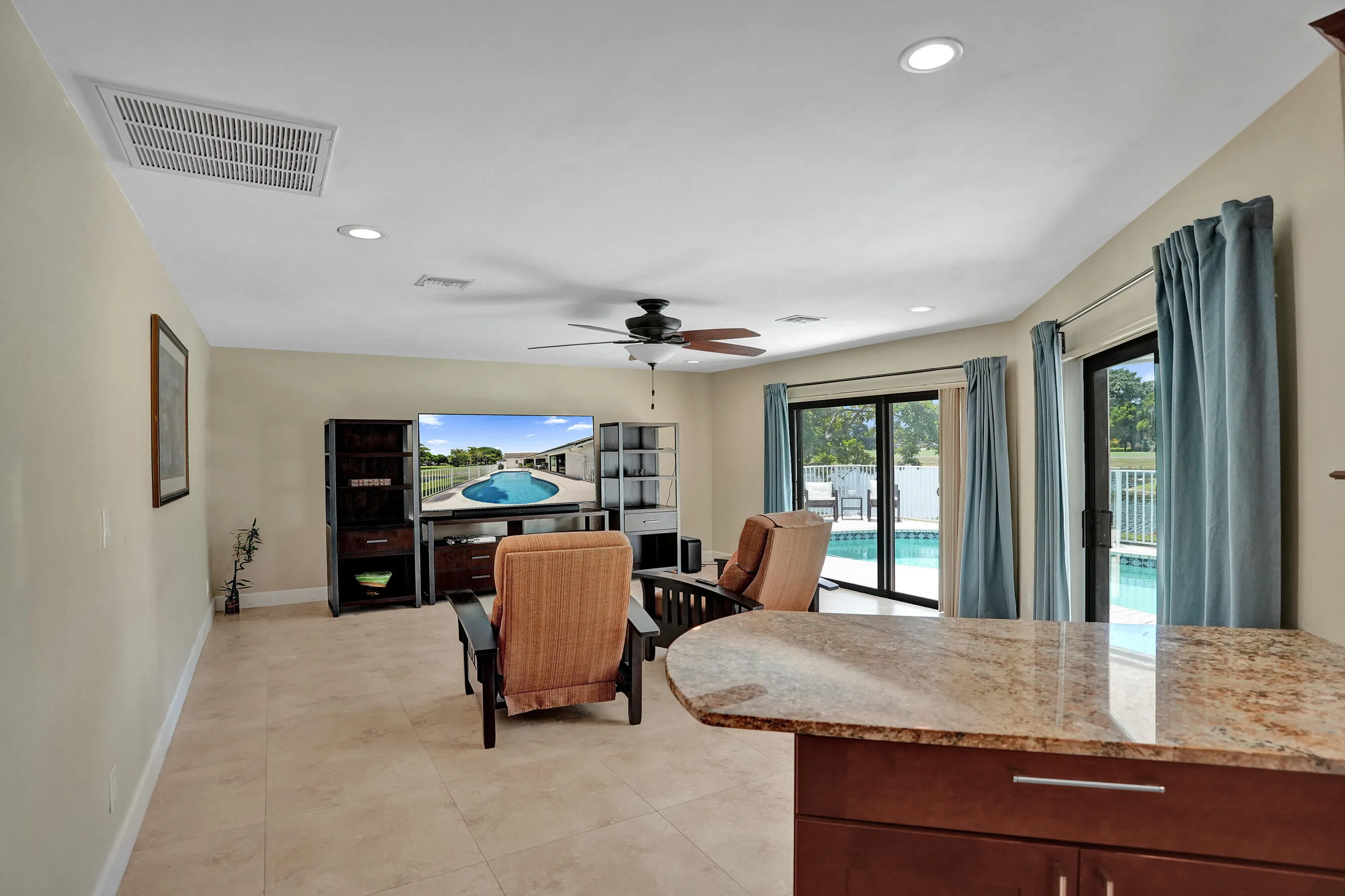 Recessed lighting, ceiling fan, and sliding glass doors