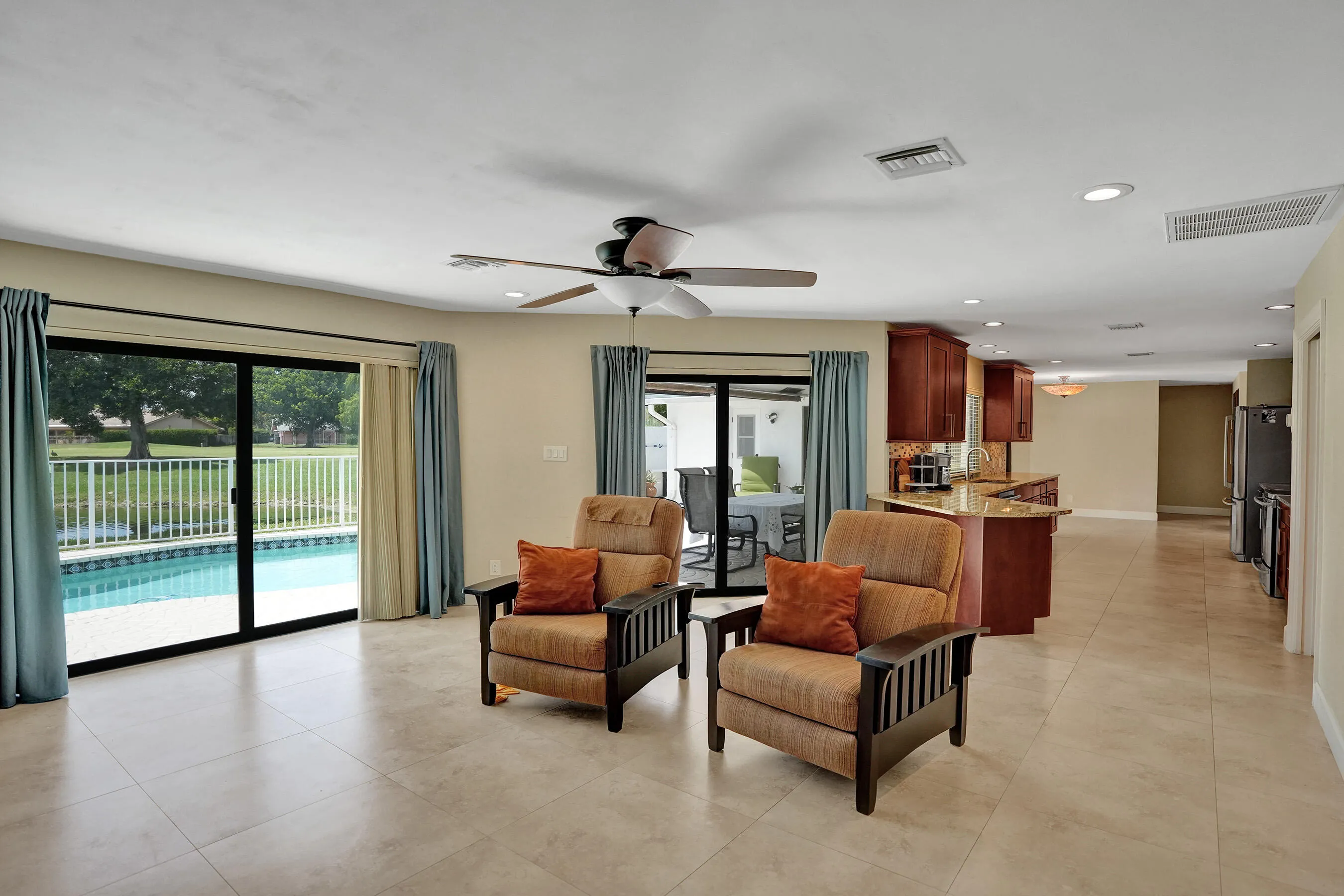 Ceramic tile flooring, recessed lighting, and a ceiling fan