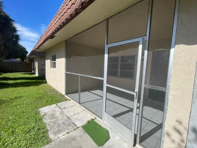 Screened patio and stucco exterior